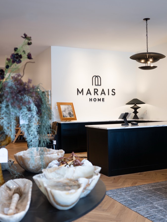 Styled console vignette with pendant lighting in the Marais Home showroom